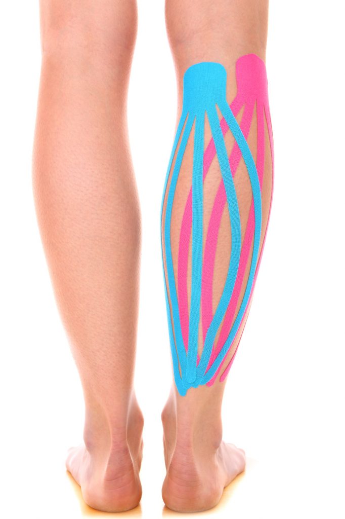 A picture of a special physio tape put on an injured calf over white background
